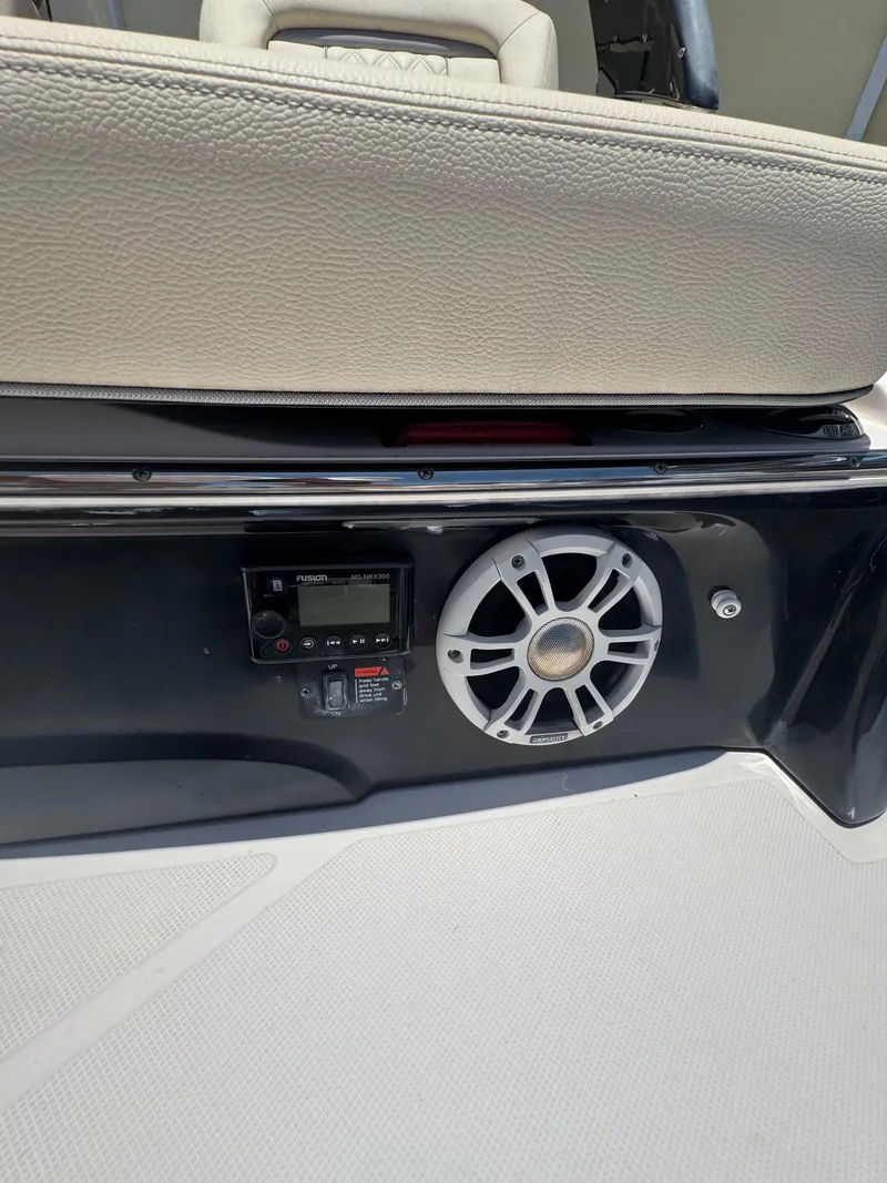 Slide: The Image of 2020 Regal LS4 boat interior with speaker and control panel. - 18