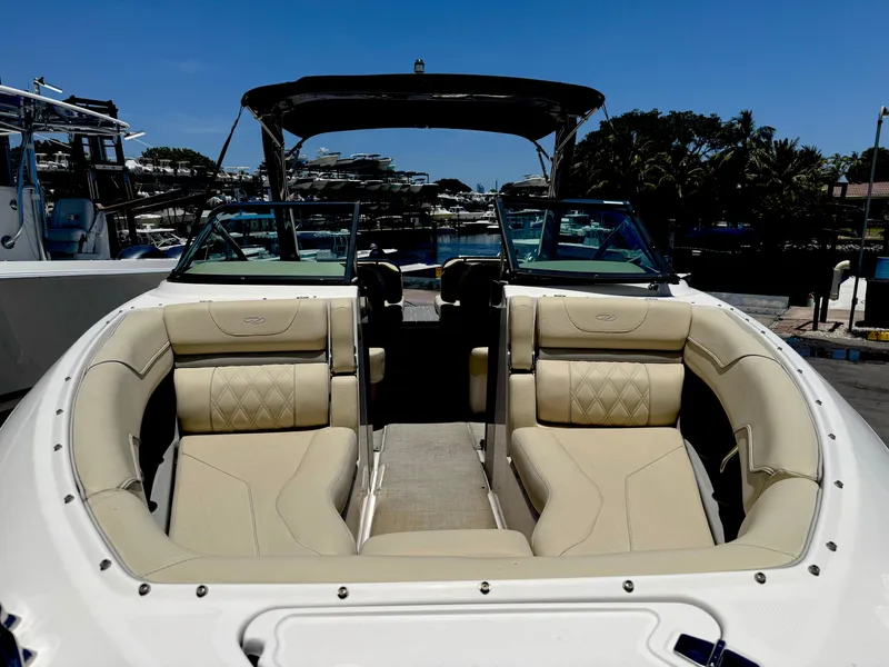 Slide: The Image of 2020 Regal LS4 boat with beige seating, docked under clear blue sky. - 5