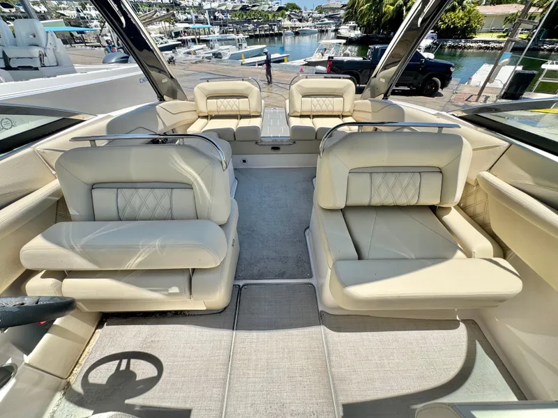 Slide: The Image of Interior of 2020 Regal LS4 boat with luxurious beige seating and waterfront view. - 7