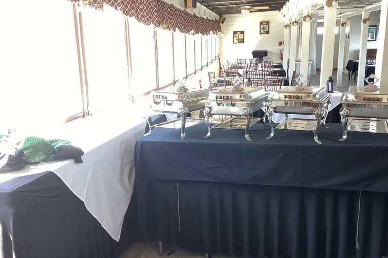 Slide: The Image of Buffet setup with chafing dishes on a Custom Paddle Wheel boat, 1984 model. - 25