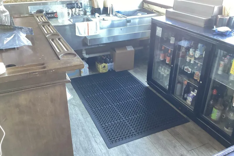 Slide: The Image of Bar area with sink, beverage cooler, and rubber mat, Custom Paddle Wheel, 1984. - 26