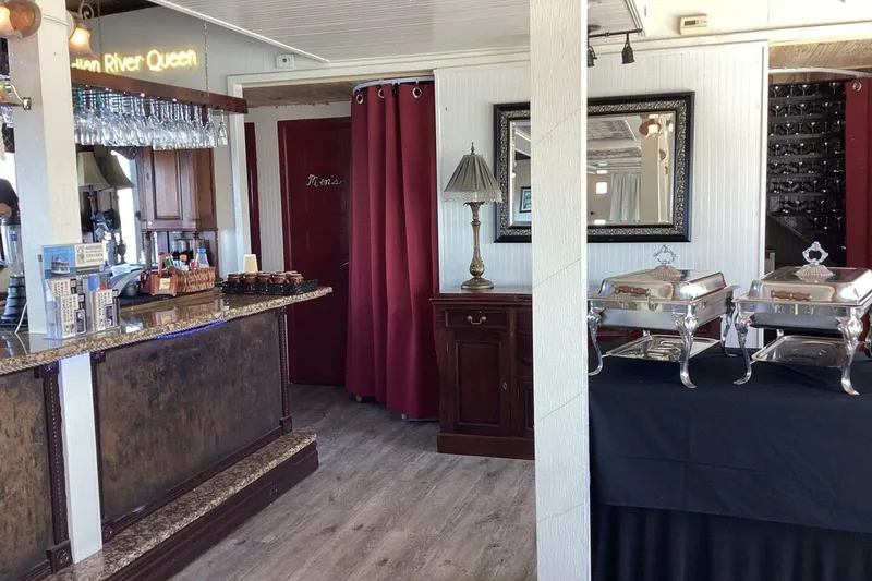 Slide: The Image of Interior of a custom 1984 paddle wheel boat with buffet setup and bar area. - 29