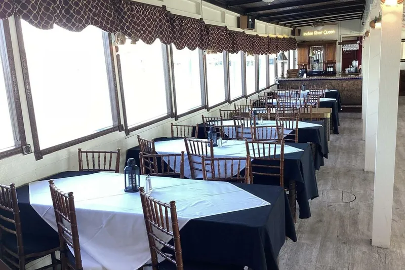Slide: The Image of Interior of 1984 Custom Paddle Wheel boat with elegant dining setup and bar area. - 30