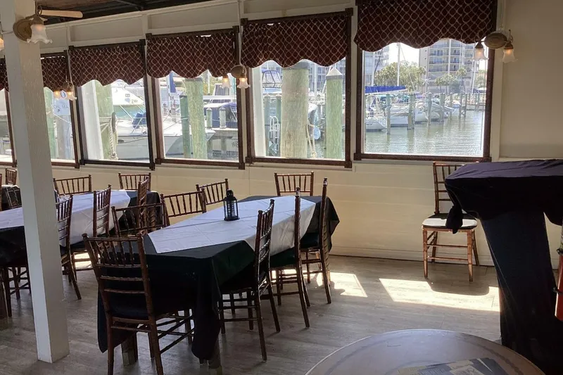 Slide: The Image of Dining area with waterfront view, featuring elegant tables and chairs, Custom Paddle Wheel, 1984. - 31