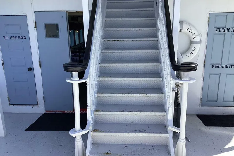 Slide: The Image of Staircase on 1984 custom paddle wheel boat with life jacket locker and lifebuoy. - 35