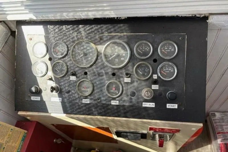 Slide: The Image of Control panel of a 1984 Custom Paddle Wheel with various gauges and switches. - 41