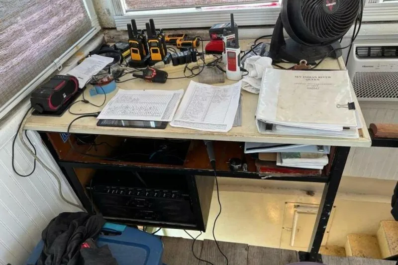Slide: The Image of Desk with communication devices, fan, and documents on a Custom Paddle Wheel, 1984 model. - 43