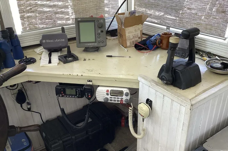 Slide: The Image of Boat control panel with navigation equipment, communication devices, and marine accessories, Custom Paddle Wheel, 1984. - 44
