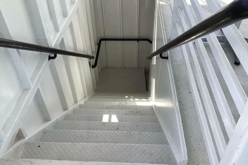 Slide: The Image of Staircase on 1984 Custom Paddle Wheel boat with white metal railings and steps. - 47