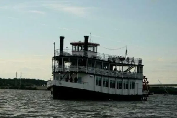Slide: The Image of Vintage 1984 custom paddle wheel boat cruising on a calm river. - 5