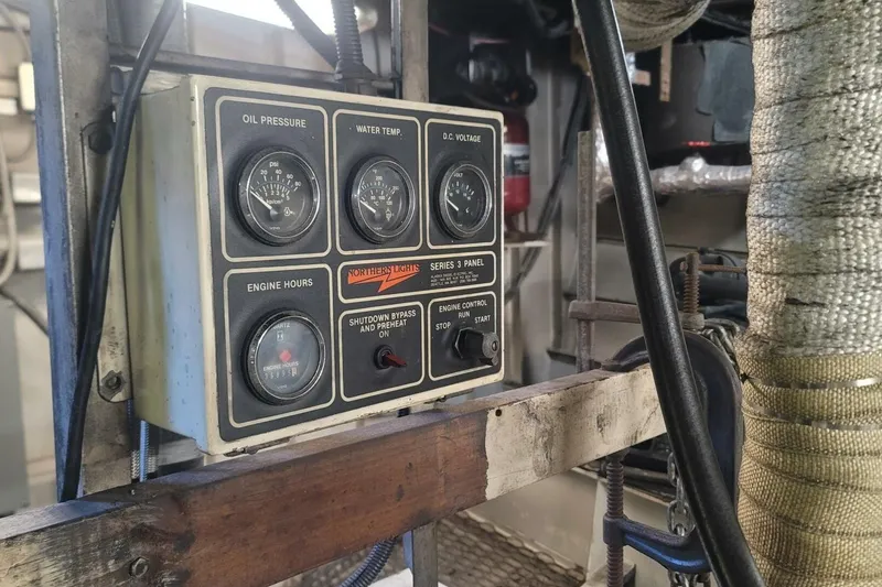 Slide: The Image of Control panel of a 1984 Custom Paddle Wheel boat with gauges and switches. - 51