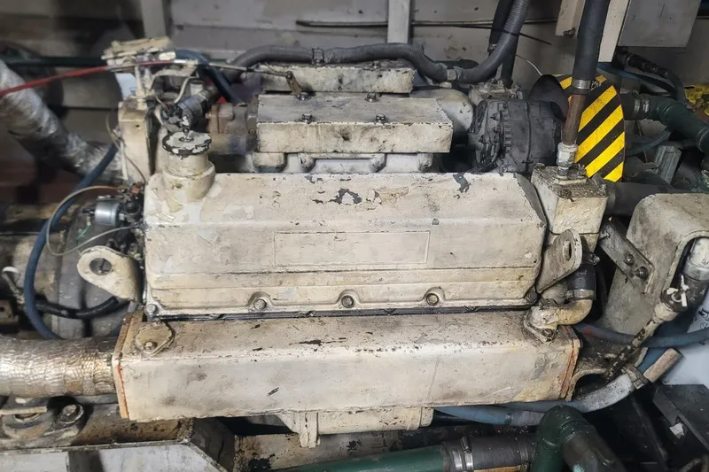 Slide: The Image of Old custom paddle wheel engine from 1984, showing wear and mechanical components. - 55