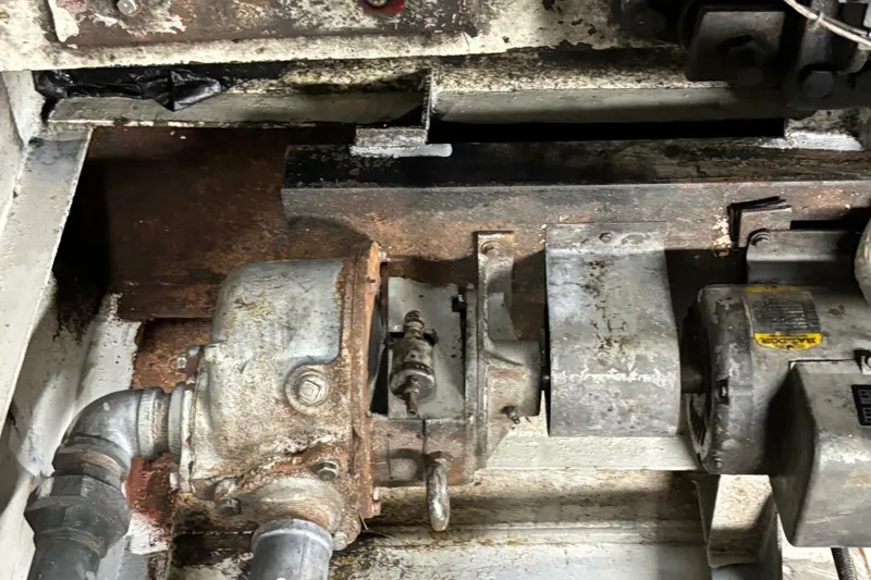 Slide: The Image of Rusty mechanical components of a 1984 Custom Paddle Wheel, showing wear and age. - 61