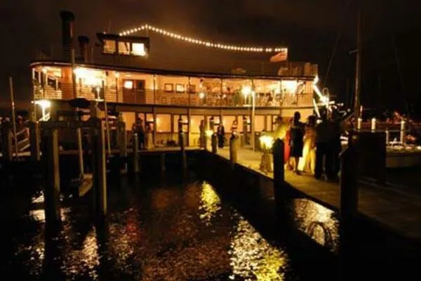 Slide: The Image of Illuminated paddle wheel boat docked at night, Custom model, 1984. - 72