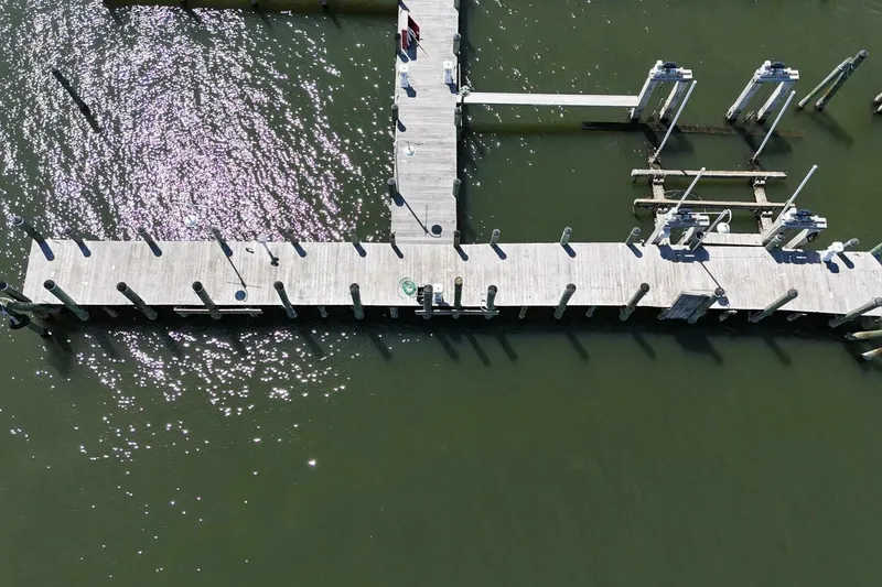 Slide: The Image of Aerial view of wooden dock over green water, Custom Paddle Wheel, 1984. - 74
