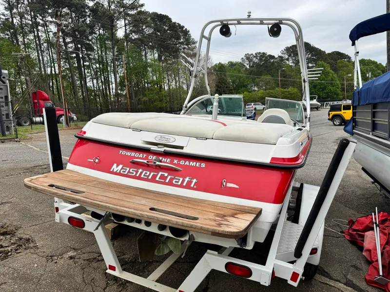 Slide: The Image of 2001 MasterCraft X-Star boat on trailer, rear view, in outdoor setting. - 4
