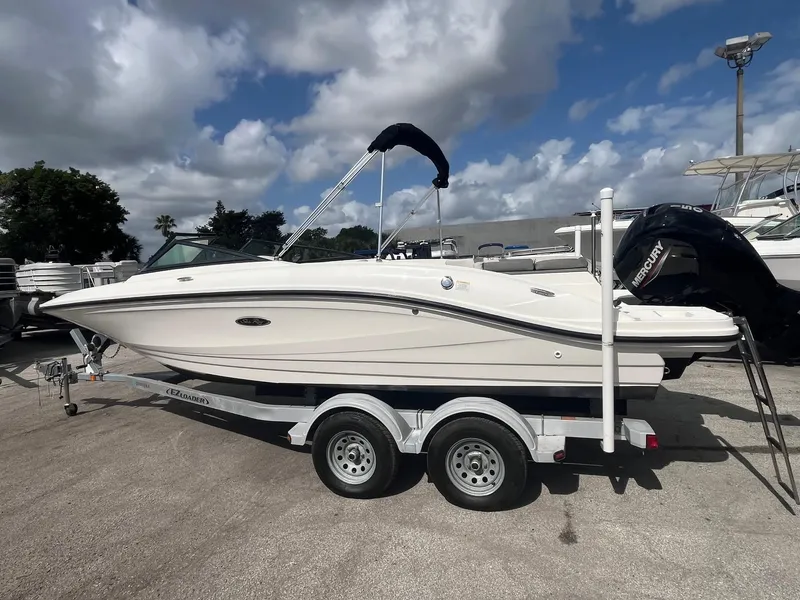 Slide: The Image of 2020 Sea Ray SPX 210 OB boat on trailer under cloudy sky. - 3