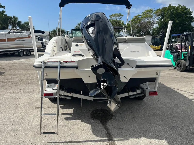 Slide: The Image of 2020 Sea Ray SPX 210 OB boat with outboard motor and swim ladder. - 5
