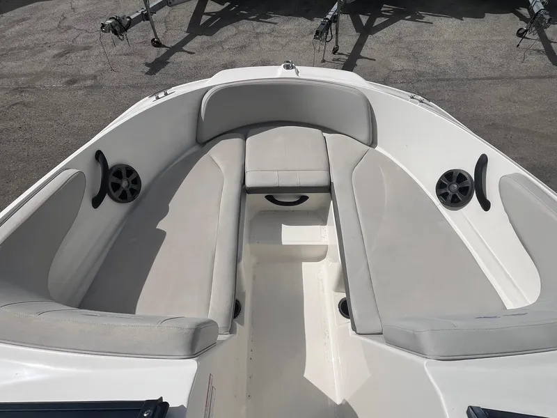 Slide: The Image of 2020 Sea Ray SPX 210 OB boat interior with cushioned seating and speakers. - 6