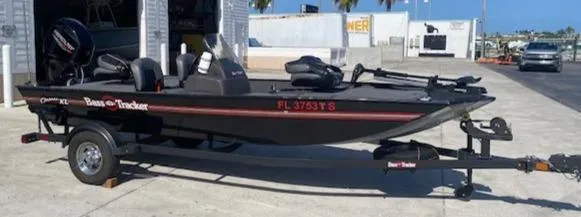 Slide: The Image of 2024 Tracker Bass Tracker Classic XL boat on trailer in outdoor setting. - 19