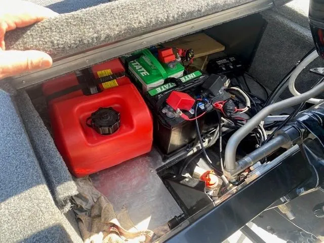 Slide: The Image of 2024 Tracker Bass Tracker Classic XL boat storage with battery and fuel tank. - 4