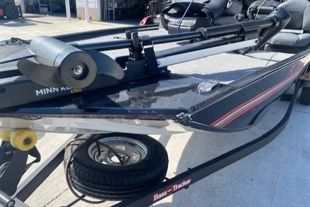 Slide: The Image of 2024 Tracker Bass Tracker Classic XL boat on trailer, featuring Minn Kota trolling motor. - 6