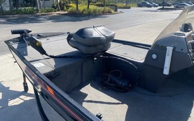 Slide: The Image of 2024 Tracker Bass Tracker Classic XL boat interior with seating and controls. - 8