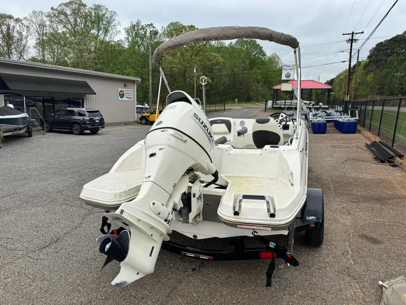 Slide: The Image of 2019 Stingray 182 SC boat with Suzuki outboard motor on a trailer. - 4