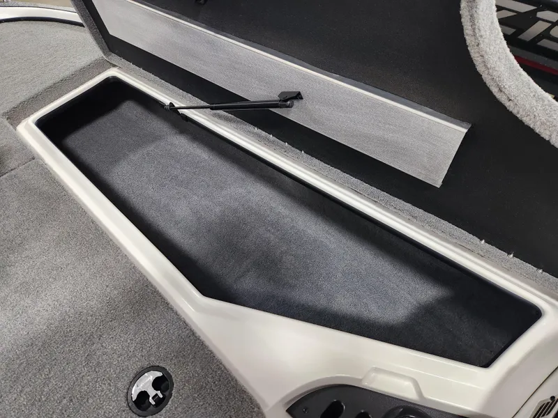 Slide: The Image of Interior storage compartment of 2025 Nitro Z18 boat, featuring sleek design and ample space. - 11
