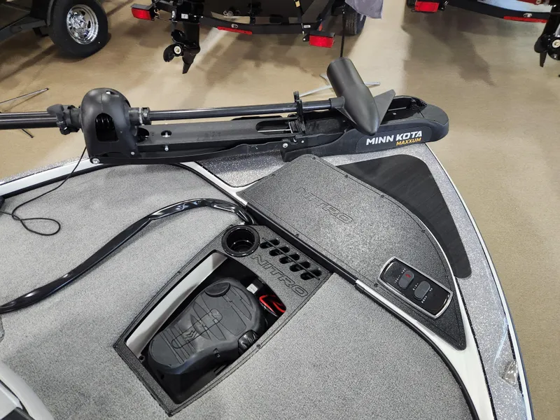 Slide: The Image of 2025 Nitro Z18 boat deck with Minn Kota trolling motor and control panel. - 15