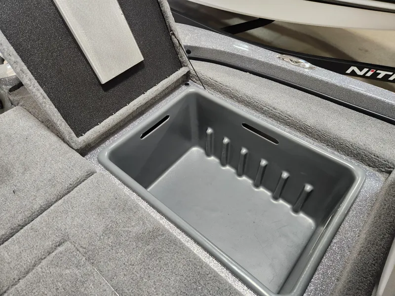 Slide: The Image of Open storage compartment in 2025 Nitro Z18 boat, featuring a spacious interior. - 19