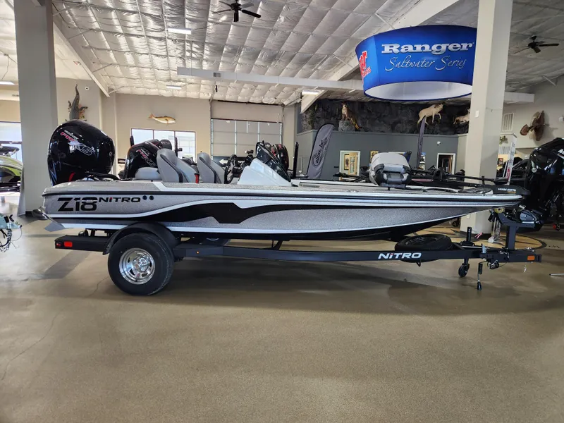 Slide: The Image of 2025 Nitro Z18 boat on display in showroom, side view. - 6