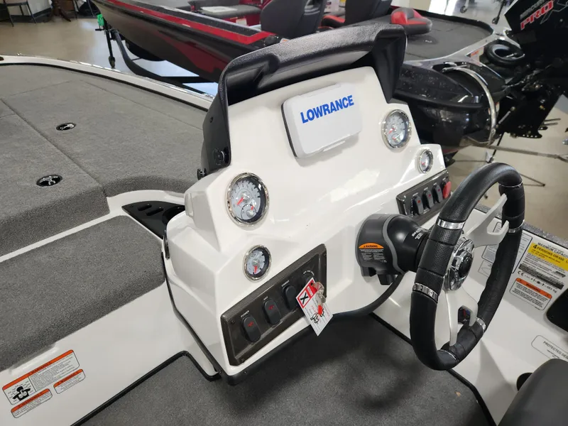 Slide: The Image of 2025 Nitro Z18 boat dashboard with Lowrance display and steering wheel. - 8