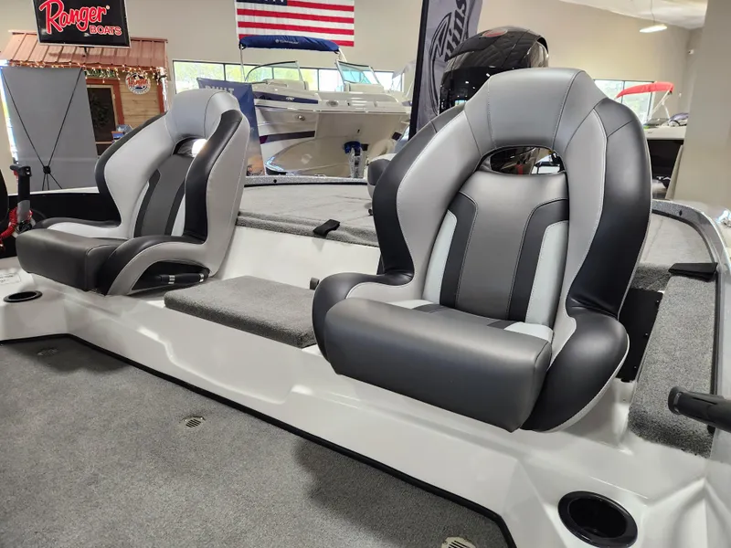 Slide: The Image of 2025 Nitro Z18 boat interior with two sleek, modern seats in a showroom setting. - 9