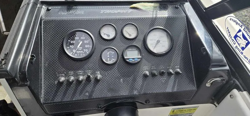 Slide: The Image of Dashboard of a 1997 Bayliner 2002 WA boat with gauges and switches. - 5