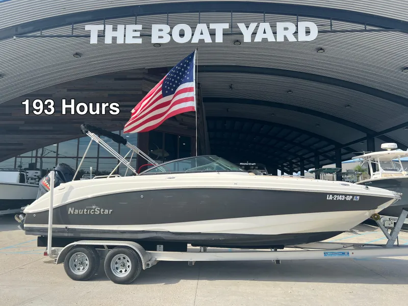 Slide: The Image of 2017 NauticStar 243 DC boat on trailer, 193 hours, at The Boat Yard. - 15
