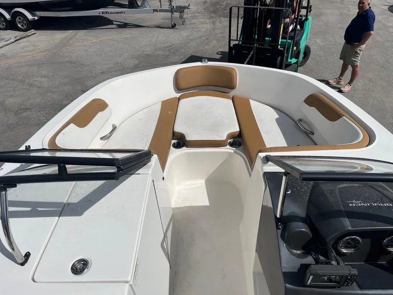 Slide: The Image of 2021 Bayliner VR6 Bowrider OB boat interior with tan seating and white deck. - 4