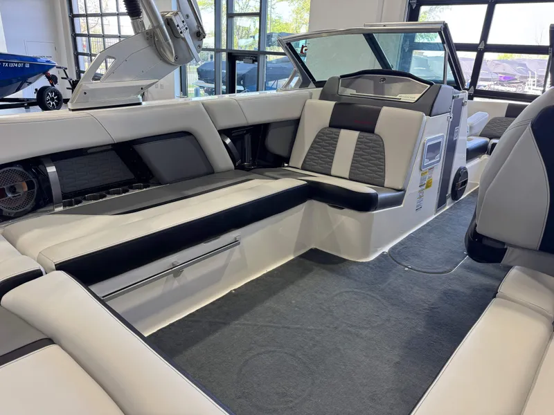 Slide: The Image of 2019 MasterCraft X22 boat interior with sleek seating and modern design. - 14