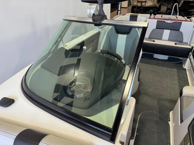 Slide: The Image of 2019 MasterCraft X22 boat interior with sleek seating and modern dashboard. - 19
