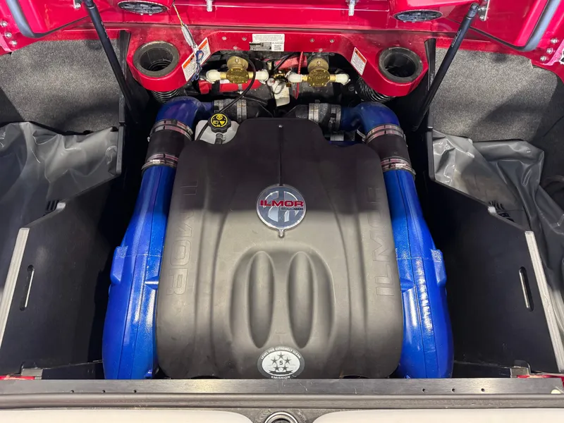 Slide: The Image of 2019 MasterCraft X22 Ilmor engine with blue accents in a red compartment. - 27