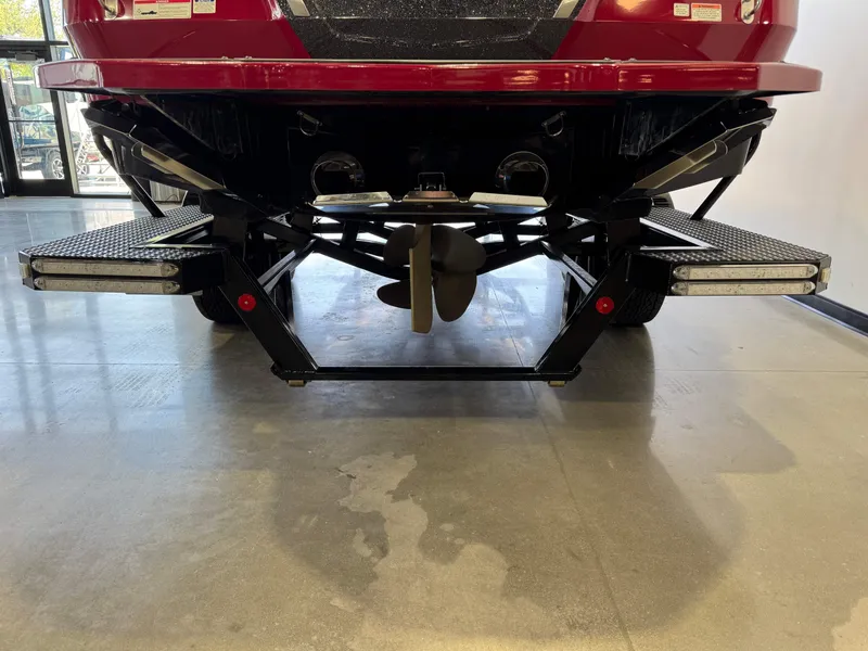 Slide: The Image of 2019 MasterCraft X22 boat rear view showing propeller and platform details. - 7