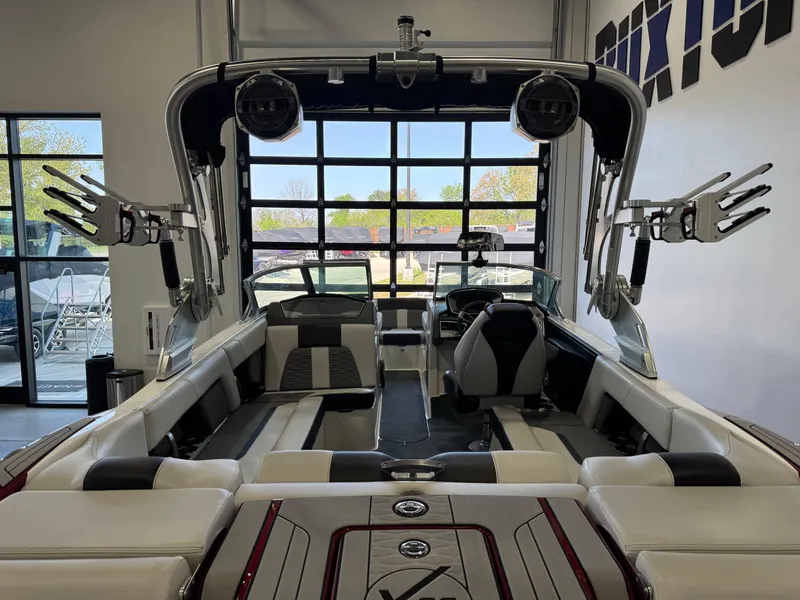 Slide: The Image of 2019 MasterCraft X22 boat interior with sleek seating and advanced audio system. - 9