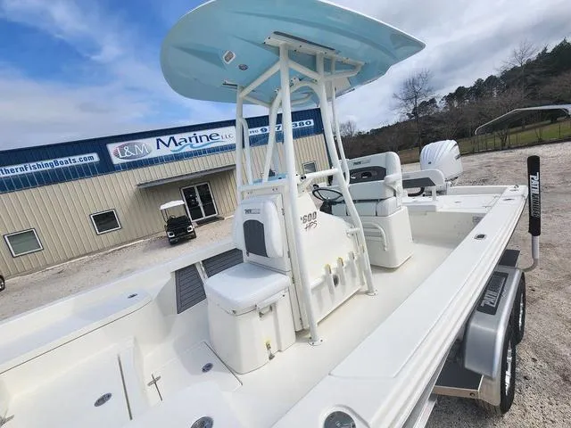 Slide: The Image of 2024 Pathfinder 2600 HPS boat at dealership, featuring sleek design and modern amenities. - 17