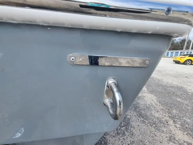 Slide: The Image of 2024 Pathfinder 2600 HPS boat detail with metal hardware, parked on gravel. - 20