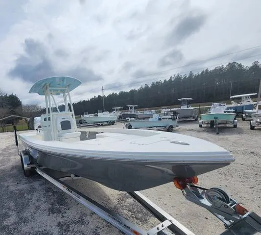 Slide: The Image of 2024 Pathfinder 2600 HPS boat on trailer, parked outdoors under cloudy sky. - 3