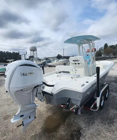 Slide: The Image of 2024 Pathfinder 2600 HPS boat with Yamaha engine on a trailer, parked outdoors. - 7