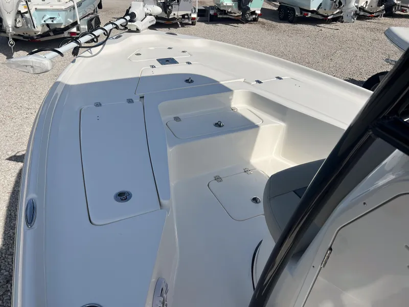 Slide: The Image of 2025 Key West 230 Bay Reef boat deck with storage compartments and seating. - 18