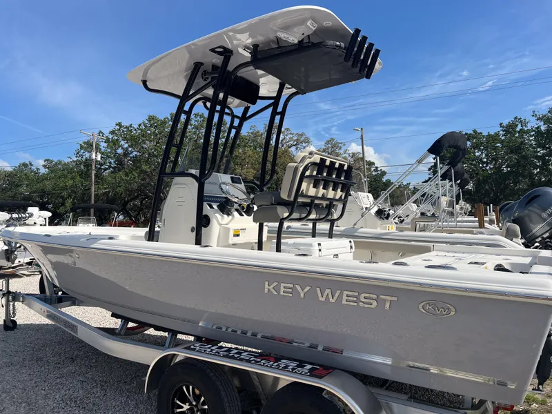 Slide: The Image of 2025 Key West 230 Bay Reef boat on trailer, featuring sleek design and modern amenities. - 2