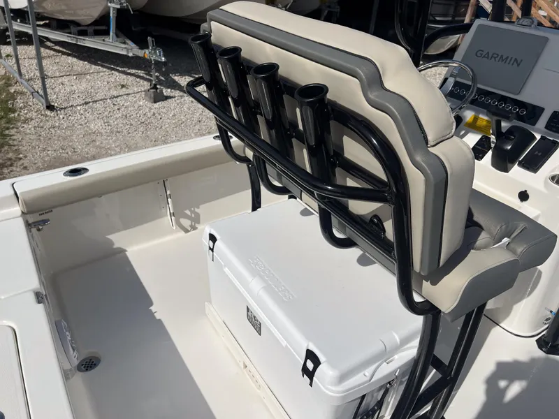 Slide: The Image of 2025 Key West 230 Bay Reef boat interior with rod holders and cooler. - 21