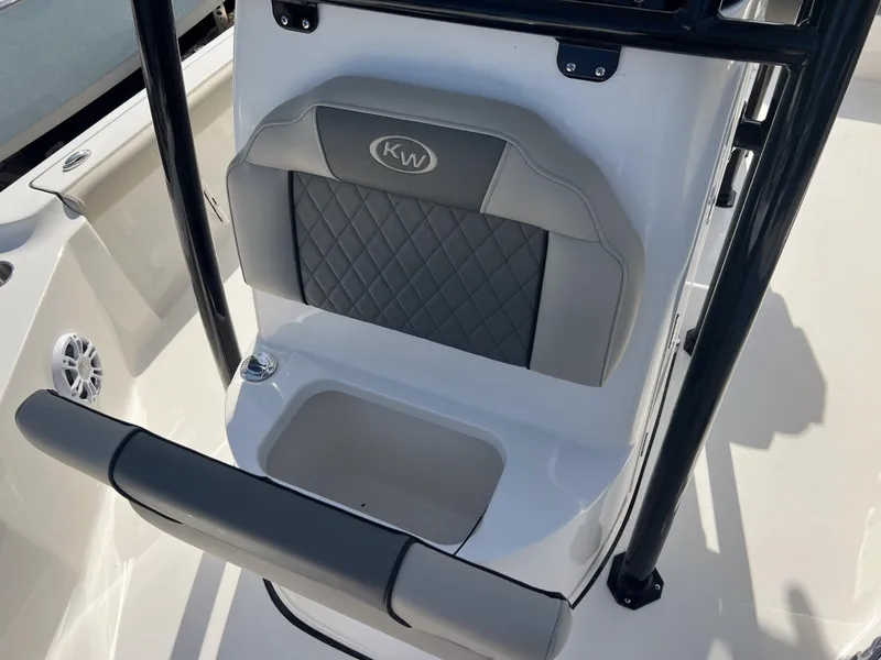 Slide: The Image of 2025 Key West 230 Bay Reef boat seat with storage and KW logo. - 23